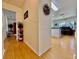Hallway view leading to a spacious kitchen and dining area with hardwood flooring at 3828 6Th W Ave, Palmetto, FL 34221