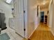 Hallway leading to utility room featuring washer, dryer, and water heater at 3828 6Th W Ave, Palmetto, FL 34221