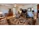 Comfortable living room with hardwood floors, ceiling fan, comfortable seating, and access to a kitchen bar at 3828 6Th W Ave, Palmetto, FL 34221