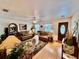 Bright living room with warm-toned furnishings, natural light, and hardwood flooring, creating an inviting space at 3828 6Th W Ave, Palmetto, FL 34221