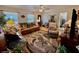 Cozy living room with hardwood floors, ceiling fan, with comfortable seating and bright natural lighting at 3828 6Th W Ave, Palmetto, FL 34221