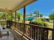 Relaxing porch with outdoor seating, greenery, and neighborhood views, perfect for enjoying quiet moments at 3828 6Th W Ave, Palmetto, FL 34221