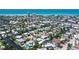 A neighborhood aerial showcasing canal-front homes and a community close to the beach at 385 Avenida Madera, Sarasota, FL 34242
