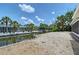 Backyard canal featuring lush landscaping, neighboring homes, and a serene waterfront view at 385 Avenida Madera, Sarasota, FL 34242