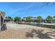 Waterfront backyard with a canal view and tropical landscaping on a sunny day at 385 Avenida Madera, Sarasota, FL 34242