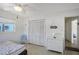 Well-lit bedroom with a closet, a three-drawer dresser, and a ceiling fan for comfort at 385 Avenida Madera, Sarasota, FL 34242