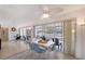 Bright dining area featuring a ceiling fan and access to the screened-in patio at 385 Avenida Madera, Sarasota, FL 34242