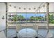 Enclosed patio seating area with outdoor furniture and a scenic view of the canal at 385 Avenida Madera, Sarasota, FL 34242