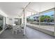 Screened patio with seating and a view of the waterfront canal for relaxing outdoor enjoyment at 385 Avenida Madera, Sarasota, FL 34242