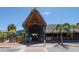 Charming outdoor restaurant featuring a thatched roof and vibrant tropical decor at 385 Avenida Madera, Sarasota, FL 34242