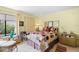 Cozy bedroom with a comfortable bed, closet, and an abundance of natural light at 4109 Carriage Dr # 23, Sarasota, FL 34241