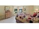 Comfortable bedroom with a large window, closet, and decorative chest of drawers at 4109 Carriage Dr # 23, Sarasota, FL 34241