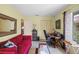 Inviting living room with comfortable seating, a closet and an abundance of natural light at 4109 Carriage Dr # 23, Sarasota, FL 34241