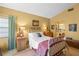 Comfortable main bedroom with tiled floors, vaulted ceilings, and adjoined to the main bathroom and walk-in closet at 4109 Carriage Dr # 23, Sarasota, FL 34241