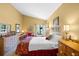 Bright main bedroom features tiled floors, vaulted ceilings, with views to the outside, and ample space to relax at 4109 Carriage Dr # 23, Sarasota, FL 34241