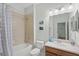 Bathroom with a tub, shower, and sink with a view into another bedroom at 4204 Overture Cir # 4204, Bradenton, FL 34209