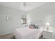 Bright bedroom with a comfortable bed, side tables with lamps, and a window, ideal for relaxation at 4204 Overture Cir # 4204, Bradenton, FL 34209