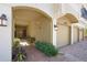 View of garage entrance to unit 4204 with brick pavers and decorative landscaping at 4204 Overture Cir # 4204, Bradenton, FL 34209