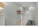 Upstairs hallway featuring tile flooring, white railings and light-blue walls at 4204 Overture Cir # 4204, Bradenton, FL 34209