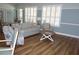 Bright community room with wood flooring, a comfortable sofa, and bright windows with shutters at 4204 Overture Cir # 4204, Bradenton, FL 34209