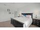 Spacious main bedroom with dark wood furniture, a ceiling fan, and neutral décor at 4204 Overture Cir # 4204, Bradenton, FL 34209