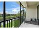 Peaceful screened-in patio with pond view and comfortable seating arrangement at 4204 Overture Cir # 4204, Bradenton, FL 34209