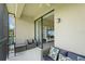 Relaxing screened-in patio with pond view and sliding door to the home's interior at 4204 Overture Cir # 4204, Bradenton, FL 34209