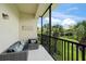 Comfortable seating on the screened in patio with scenic view of the pond at 4204 Overture Cir # 4204, Bradenton, FL 34209