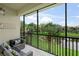 Beautiful screened in patio with comfortable seating and a peaceful view of the pond at 4204 Overture Cir # 4204, Bradenton, FL 34209