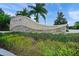 Stone sign for Palma Sola Trace with lush greenery and landscaping at 4204 Overture Cir # 4204, Bradenton, FL 34209