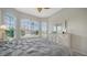 Bedroom with large window and neutral decor at 4220 Miriana Way, Sarasota, FL 34233