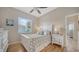 Light bedroom with light wood floors and matching dresser at 4220 Miriana Way, Sarasota, FL 34233