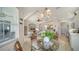 Open-concept home with a breakfast nook next to the kitchen and a view of the living room at 4220 Miriana Way, Sarasota, FL 34233