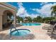 Community pool and hot tub offers residents relaxation and leisure at 4220 Miriana Way, Sarasota, FL 34233
