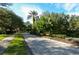 The community entrance has lush landscaping and palm trees lining the entrance at 4220 Miriana Way, Sarasota, FL 34233