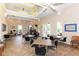 Resident fitness center features workout equipment, tables, chairs, high ceilings, and natural lighting at 4220 Miriana Way, Sarasota, FL 34233