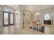Elegant foyer with tiled floor, dining area and arched doorways to the other rooms of the house at 4220 Miriana Way, Sarasota, FL 34233