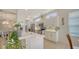 Modern kitchen with white cabinets, quartz countertops, stainless steel appliances, and mosaic backsplash at 4220 Miriana Way, Sarasota, FL 34233
