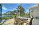 This covered patio space offers views of the community lake and nearby homes at 4220 Miriana Way, Sarasota, FL 34233