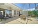 This cozy patio has outdoor furniture and access to indoor living space at 4220 Miriana Way, Sarasota, FL 34233