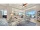 Bright living room with tile floors, elegant furniture, open floor plan to the dining area and kitchen at 4220 Miriana Way, Sarasota, FL 34233