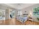 Bright main bedroom with wood floors and patio access at 4220 Miriana Way, Sarasota, FL 34233