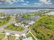 Gorgeous aerial view of the home and neighborhood with pond, green spaces, and proximity to the lake at 42250 Ramble Rd, Punta Gorda, FL 33982