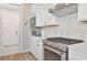 Kitchen with stainless steel appliances, light countertops, tiled backsplash, and ample cabinet space at 42250 Ramble Rd, Punta Gorda, FL 33982