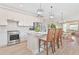 Bright kitchen featuring stainless steel appliances, an island with seating, and pendant lighting at 42250 Ramble Rd, Punta Gorda, FL 33982