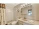 Bathroom featuring a shower-tub combo, single sink vanity, mirror and overhead lighting at 4308 Kingston Loop, Sarasota, FL 34238