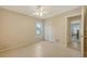 Bedroom featuring tile floors, closet with louvered doors, and interior entry door at 4308 Kingston Loop, Sarasota, FL 34238