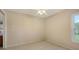 Empty bedroom with tile floors, neutral paint, a window, and a ceiling fan at 4308 Kingston Loop, Sarasota, FL 34238