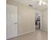 Bedroom featuring tile floors, neutral paint and interior entry door at 4308 Kingston Loop, Sarasota, FL 34238