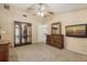 Spacious bedroom with a ceiling fan and carpet flooring at 4308 Kingston Loop, Sarasota, FL 34238